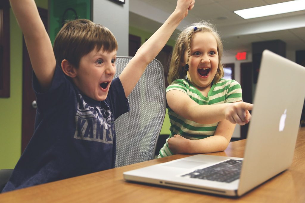 Typing Practice For Students with a boy and a girl at a laptop