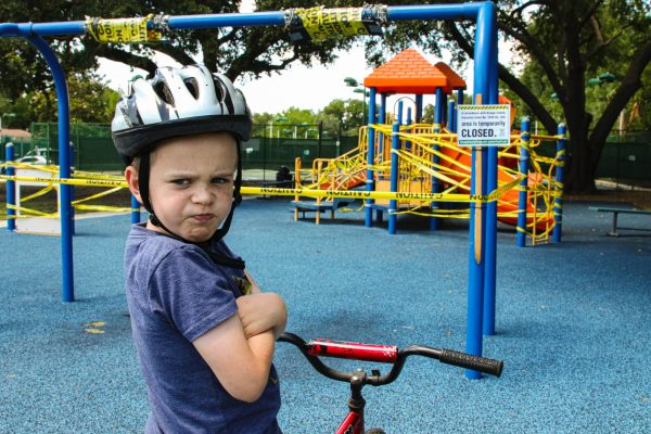 Child on bike with upset face