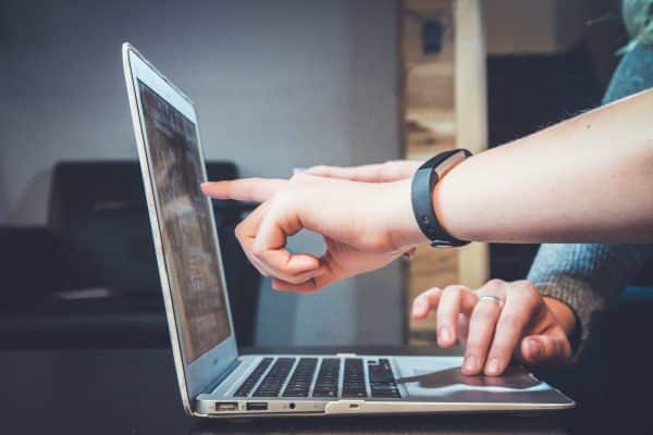 Mentoring a person using a laptop